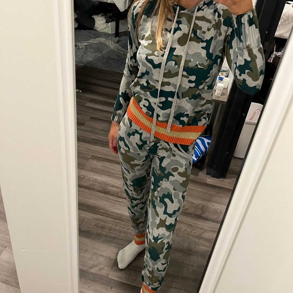 Aqua’s army and orange print sweat set from Bloomingdale’s